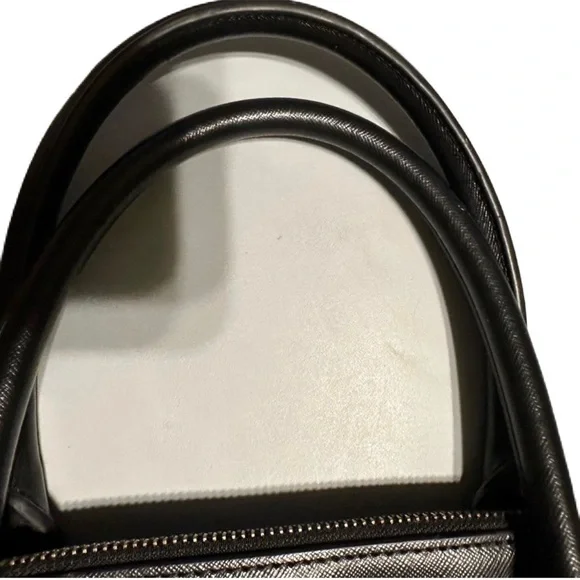 Tory Burch used handbag. About 15” wide and 13 “ tall. This bag is not new.